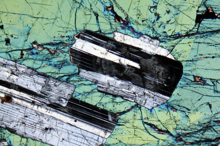 Poikilitic texture - A large augite surrounding a plagioclase mineral crystal